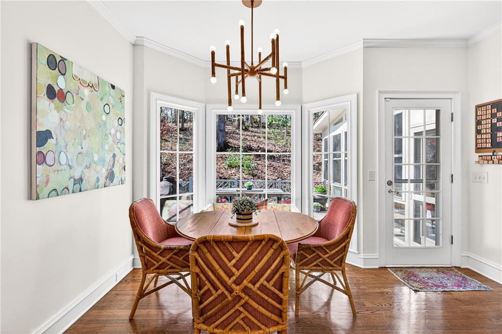 3642 Mayfair Road Northeast Atlanta, GA 30305 - Photo 11 of 40 a view of a dining room with furniture window and wooden floor