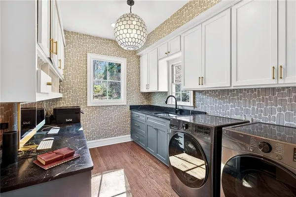 a kitchen that has a sink and a stove