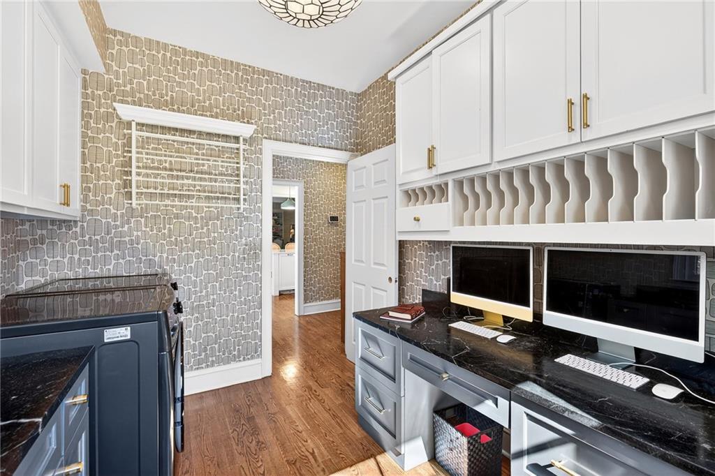 3642 Mayfair Road Northeast Atlanta, GA 30305 - Photo 15 of 40 a living room with a fireplace and a flat screen tv