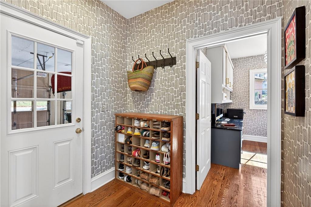 3642 Mayfair Road Northeast Atlanta, GA 30305 - Photo 17 of 40 a view of a entryway and wooden floor in a living room