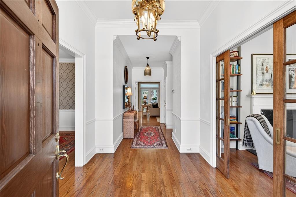 3642 Mayfair Road Northeast Atlanta, GA 30305 - Photo 18 of 40 a view of a hallway with wooden floor and staircase