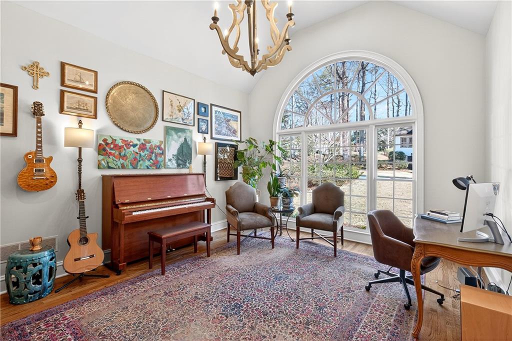3642 Mayfair Road Northeast Atlanta, GA 30305 - Photo 19 of 40 a living room with furniture a rug and a large window
