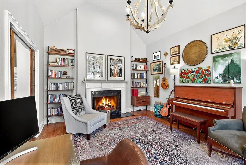3642 Mayfair Road Northeast Atlanta, GA 30305 - Photo 20 of 40 a living room with furniture and a fireplace