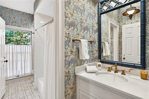 a bathroom with a sink and a mirror