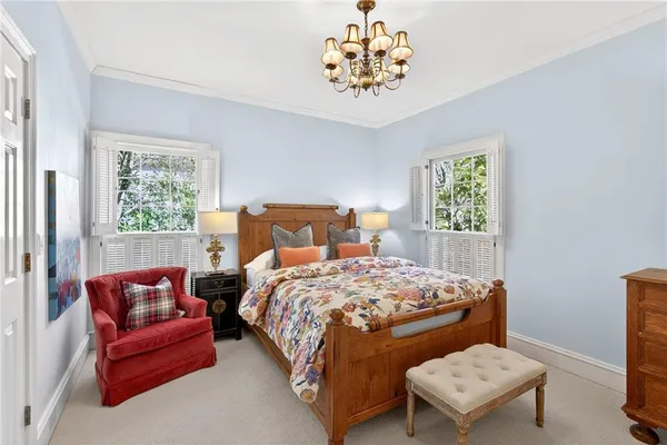 a bedroom with a bed and a couch