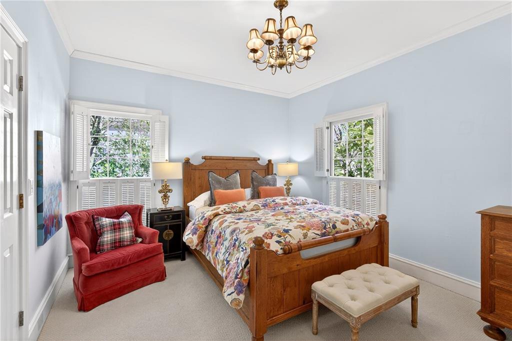 3642 Mayfair Road Northeast Atlanta, GA 30305 - Photo 27 of 40 a bedroom with a bed and a couch