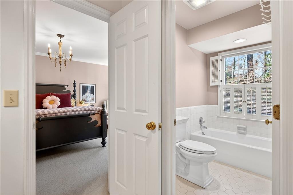 3642 Mayfair Road Northeast Atlanta, GA 30305 - Photo 28 of 40 a bathroom with a bathtub sink and toilet
