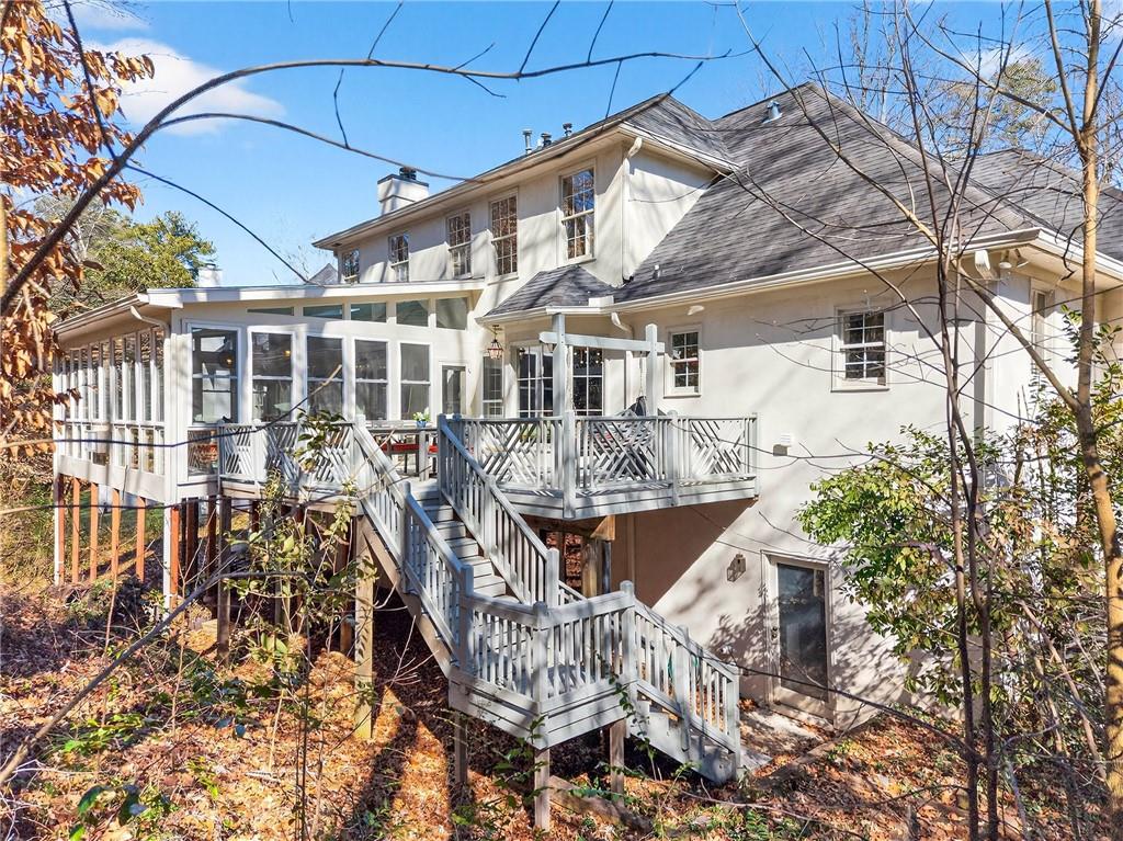 3642 Mayfair Road Northeast Atlanta, GA 30305 - Photo 3 of 40 a front view of a house with a yard