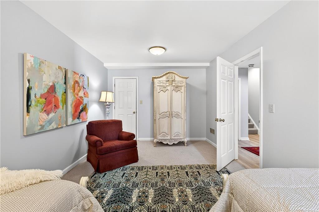 3642 Mayfair Road Northeast Atlanta, GA 30305 - Photo 34 of 40 a bedroom with furniture and a rug