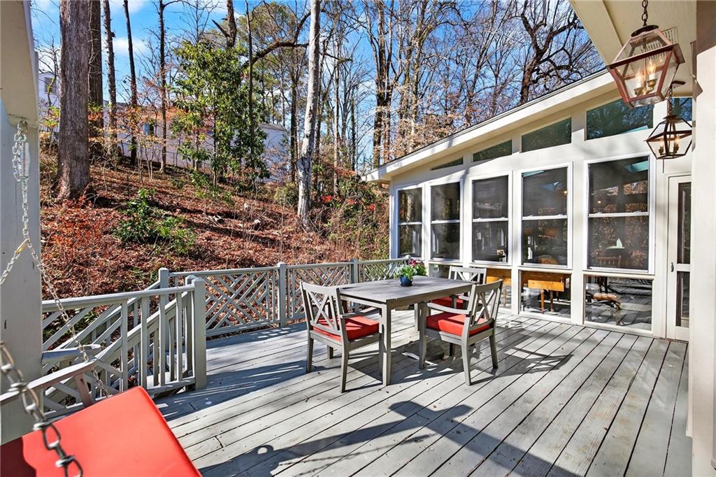 3642 Mayfair Road Northeast Atlanta, GA 30305 - Photo 37 of 40 a wooden bench sitting in front of a building