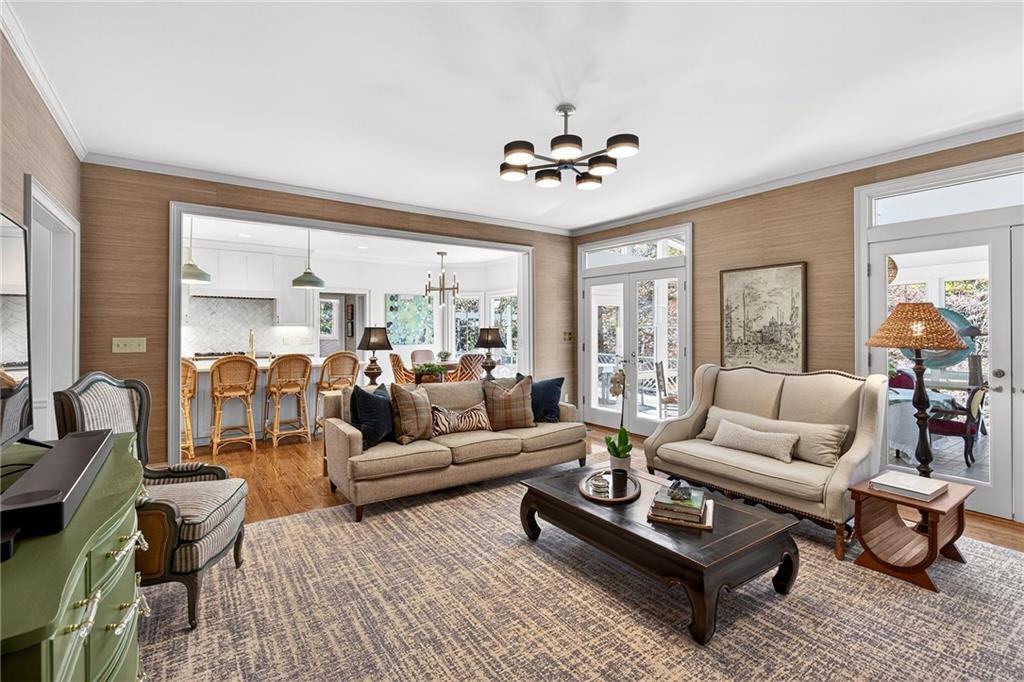3642 Mayfair Road Northeast Atlanta, GA 30305 - Photo 5 of 40 a living room with furniture a rug potted plant and a large window