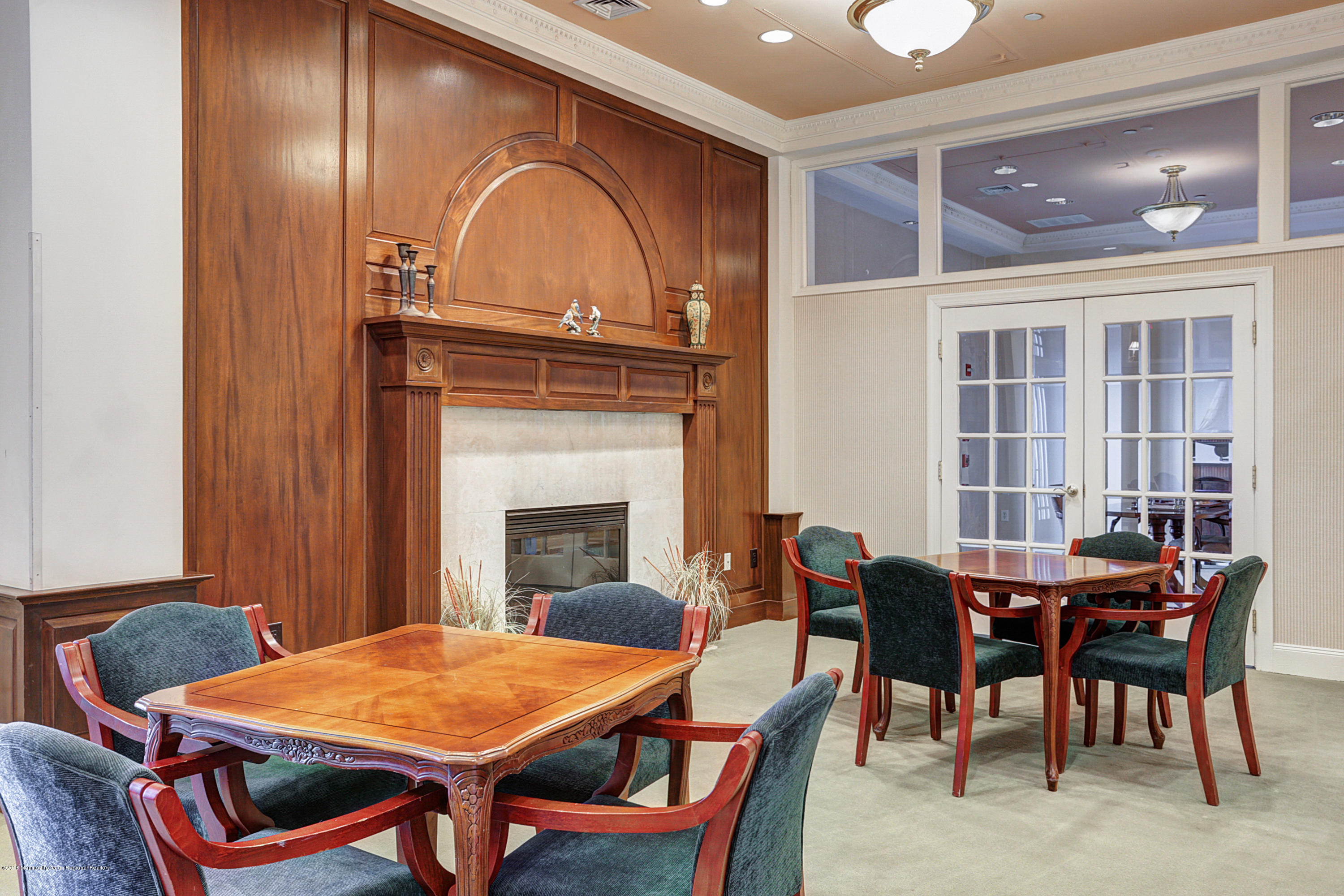 700 Ocean Avenue, Unit 437 Spring Lake, NJ 07762 - Photo 21 of 24 a view of a dining room with furniture and chandelier