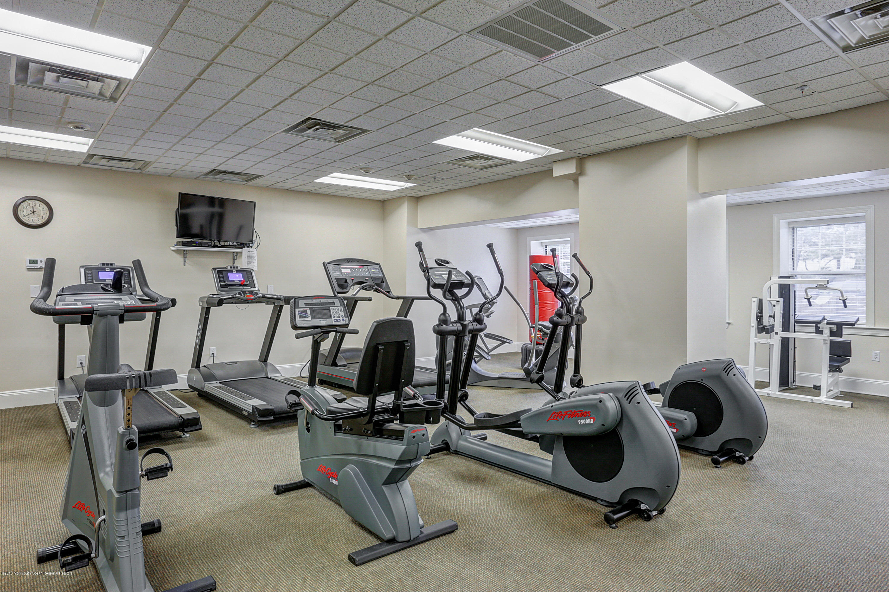 700 Ocean Avenue, Unit 437 Spring Lake, NJ 07762 - Photo 24 of 24 a view of a room with gym equipment