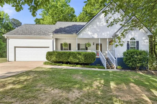 a view of front of house with a yard