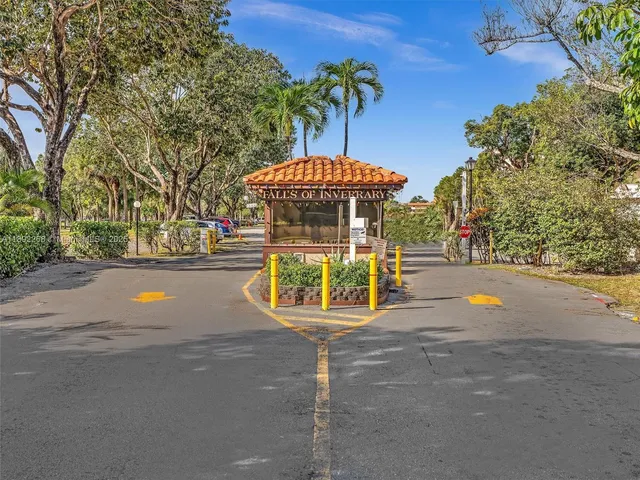 a view of street with an house