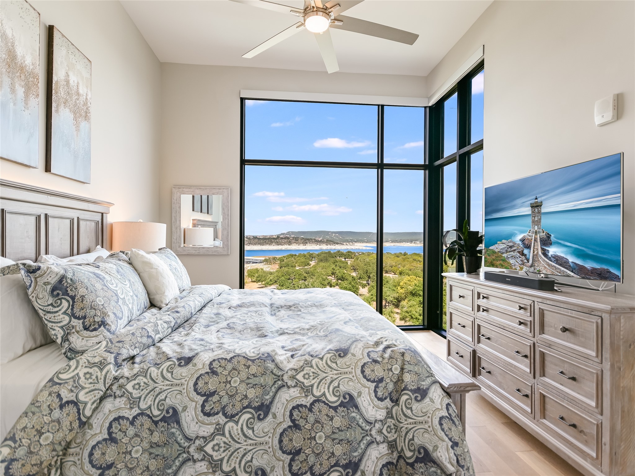 5921 Hiline Road, Unit 1501 Austin, TX 78734 - Photo 12 of 38 a bedroom with a large bed and a large window