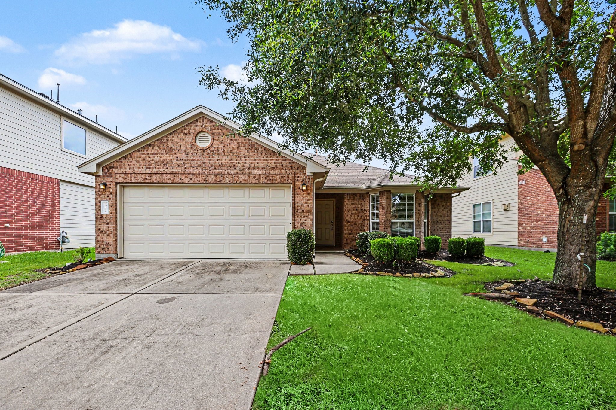 25222 Ginger Ranch Drive Katy, TX 77494 - Photo 3 of 33 This inviting single-story brick home features a two-car garage and a well-maintained front yard with mature trees and shrubs, offering great curb appeal in a quiet neighborhood.