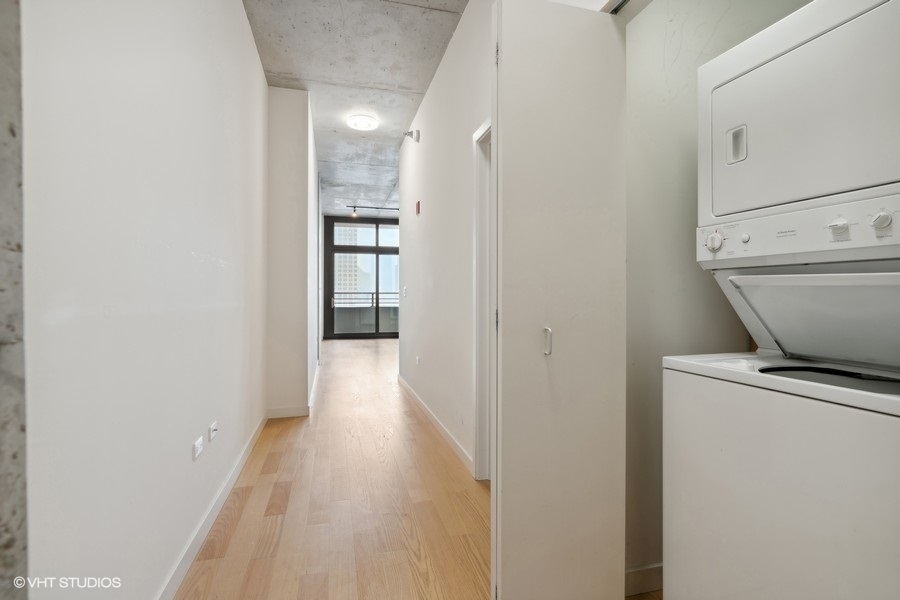 235 West Van Buren Street, Unit 4121 Chicago, IL 60607 - Photo 16 of 25 a view of a room with wooden floor