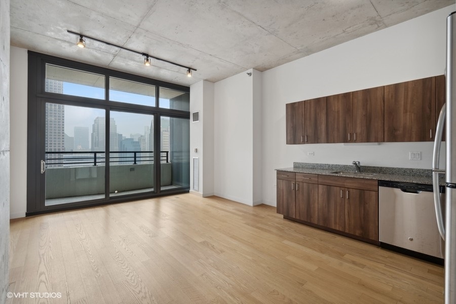 235 West Van Buren Street, Unit 4121 Chicago, IL 60607 - Photo 10 of 25 a view of a kitchen with a sink and cabinets