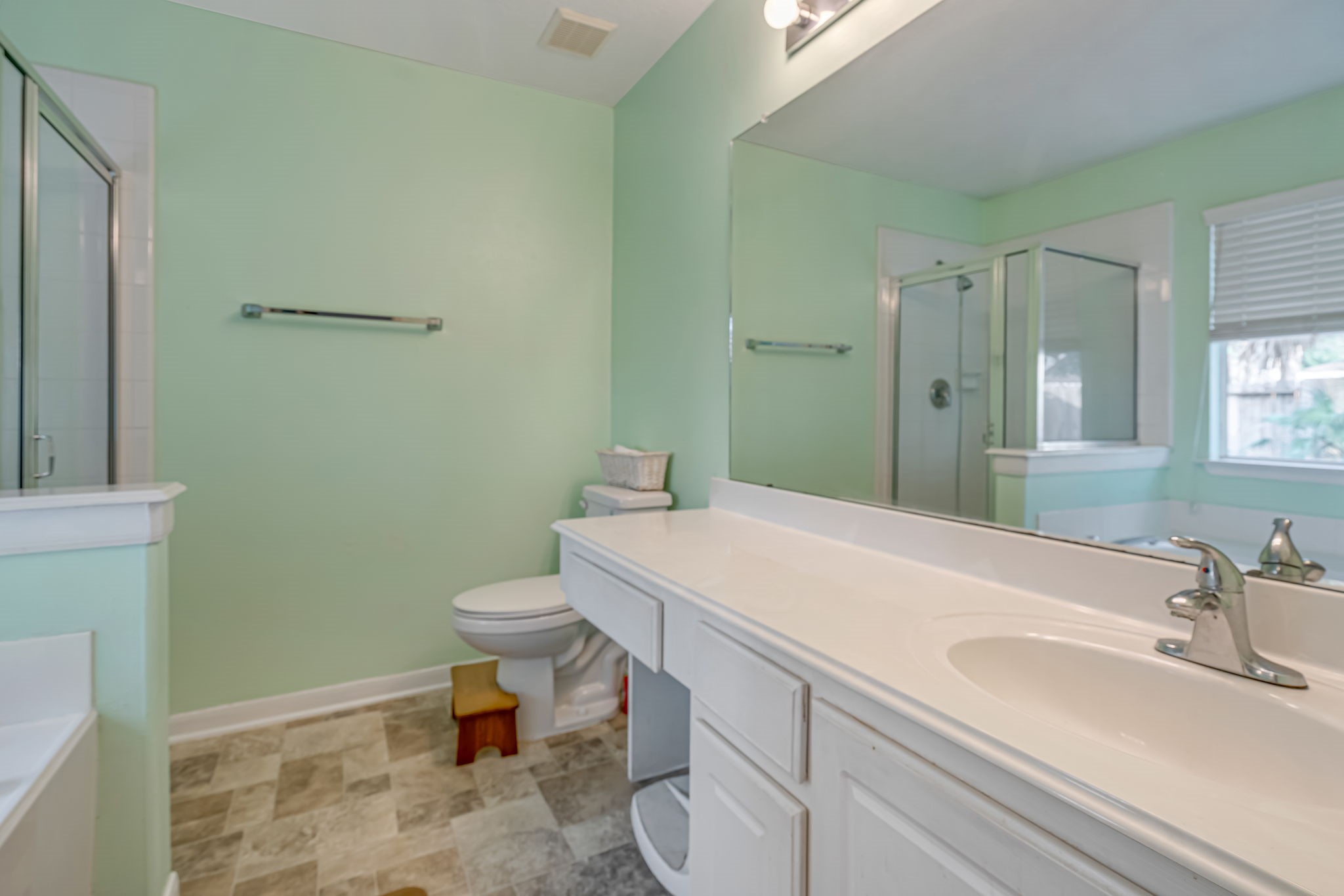 4614 Neches Trail Lane Spring, TX 77388 - Photo 12 of 29 a bathroom with a sink a toilet and a mirror