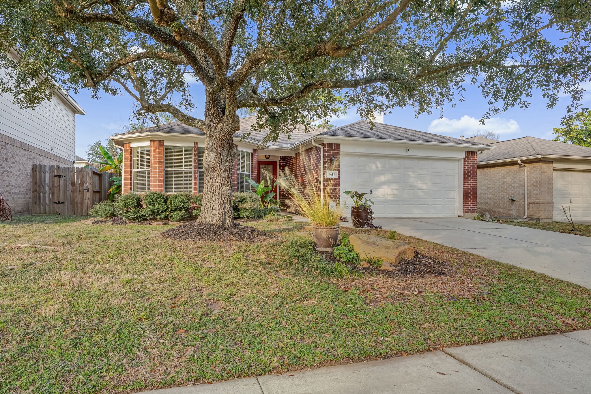 4614 Neches Trail Lane Spring, TX 77388 - Photo 2 of 29 a front view of a house with garden