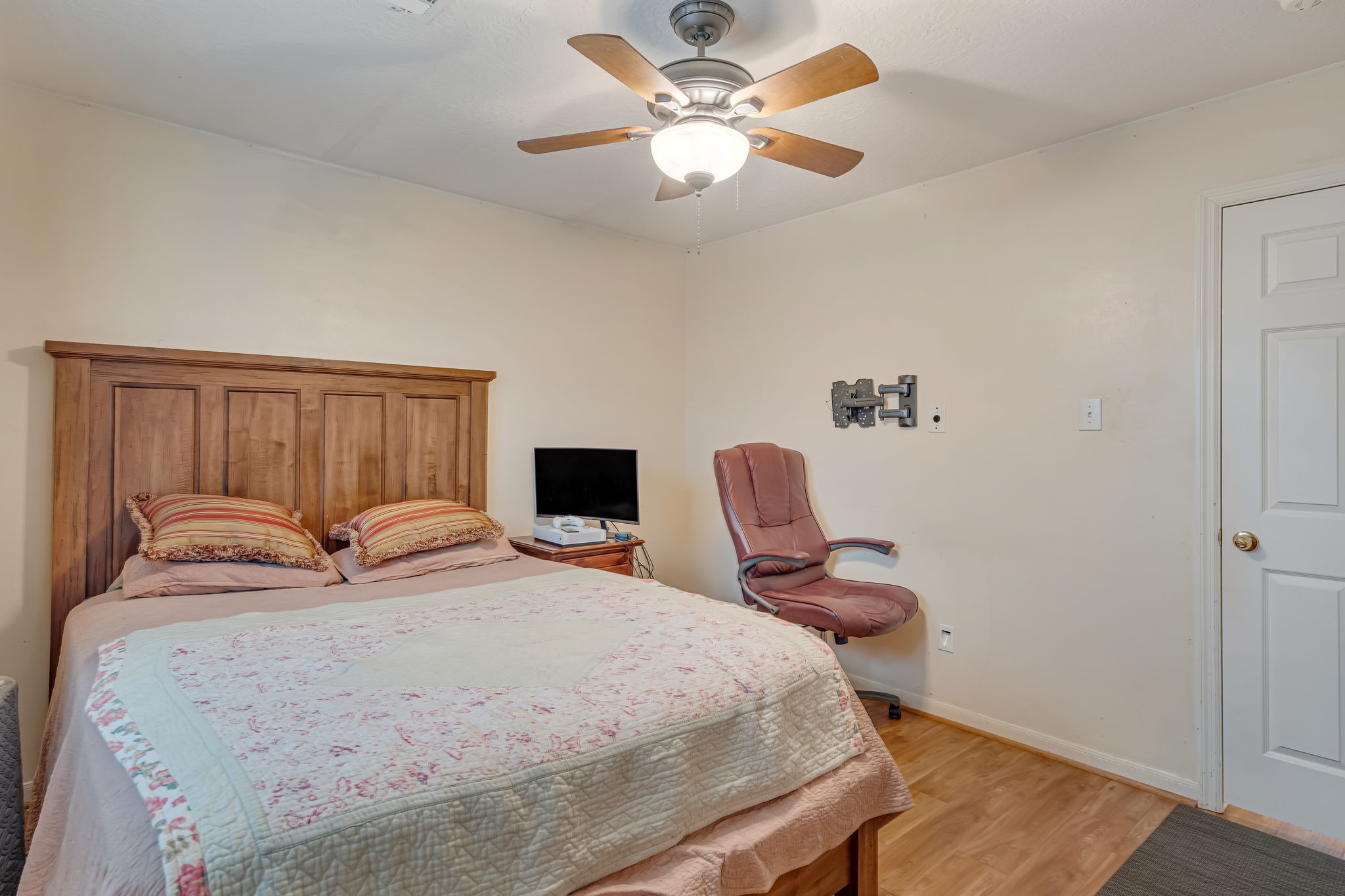 4614 Neches Trail Lane Spring, TX 77388 - Photo 25 of 29 a bedroom with a bed and a chandelier