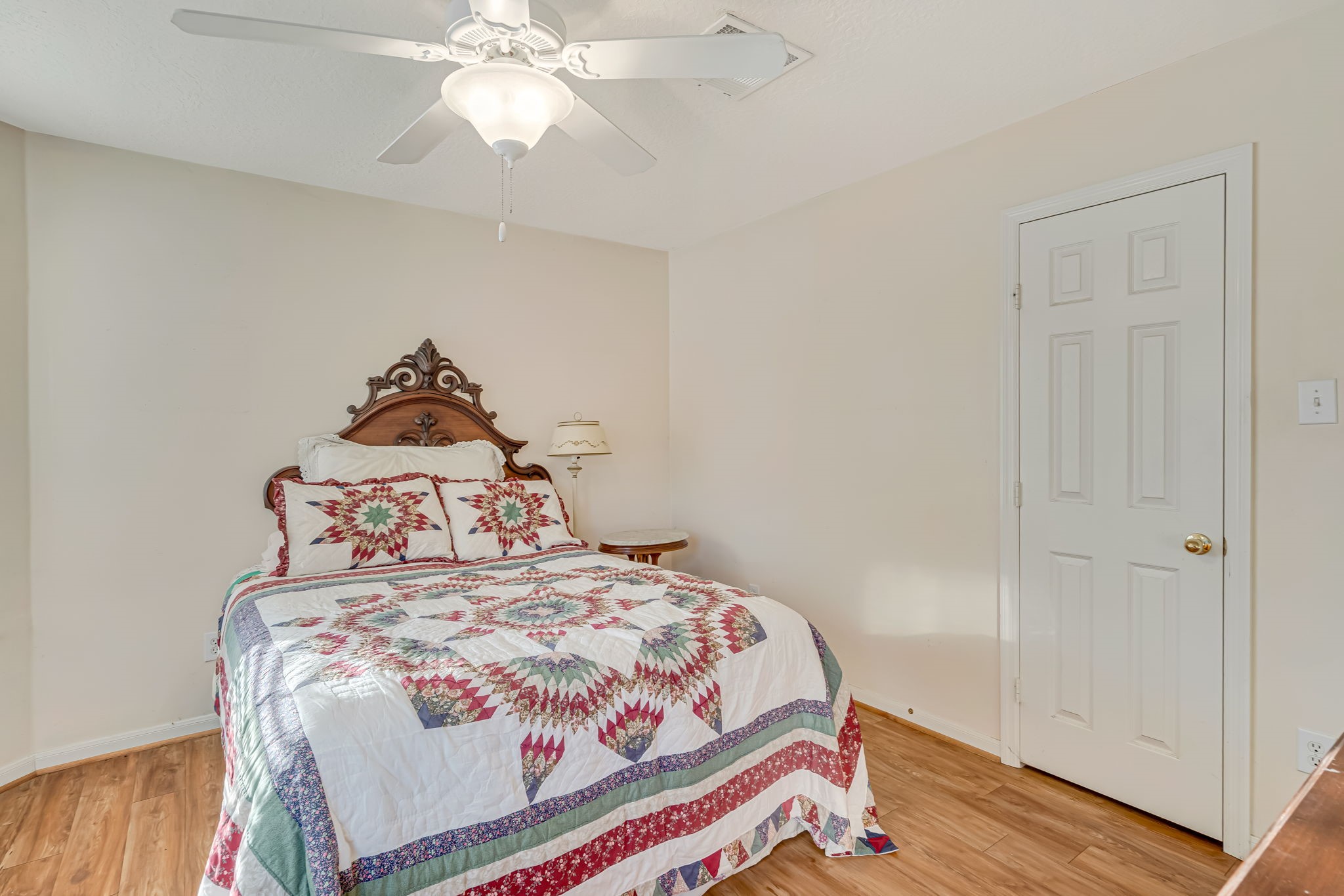 4614 Neches Trail Lane Spring, TX 77388 - Photo 26 of 29 a bedroom with a bed and a chandelier