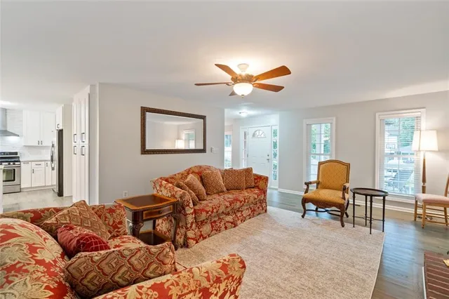 a living room with furniture and a lamp