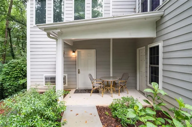 a view of a house with patio and garden
