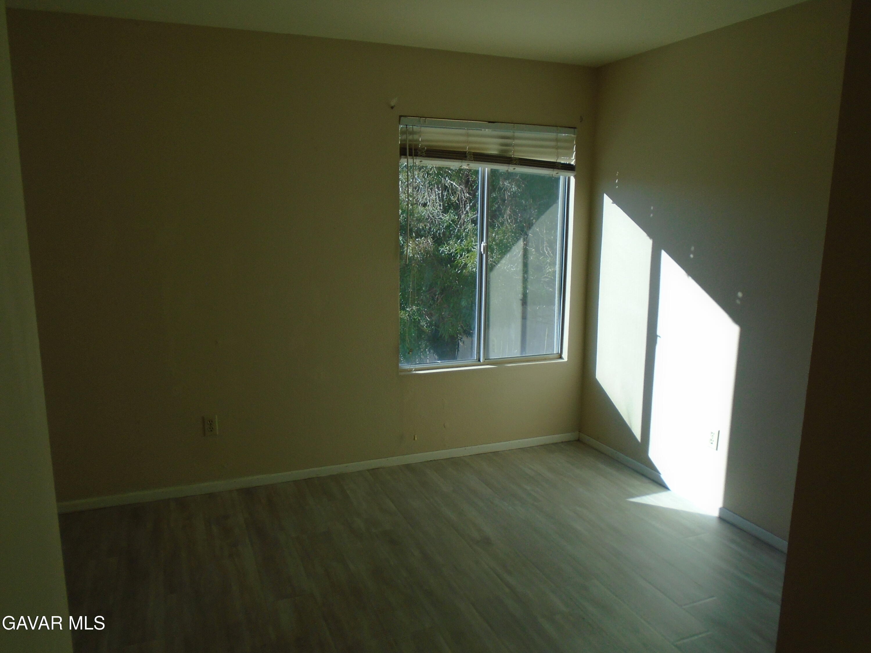 37739 Cardiff Street Palmdale, CA 93550 - Photo 21 of 32 a view of an empty room with a window