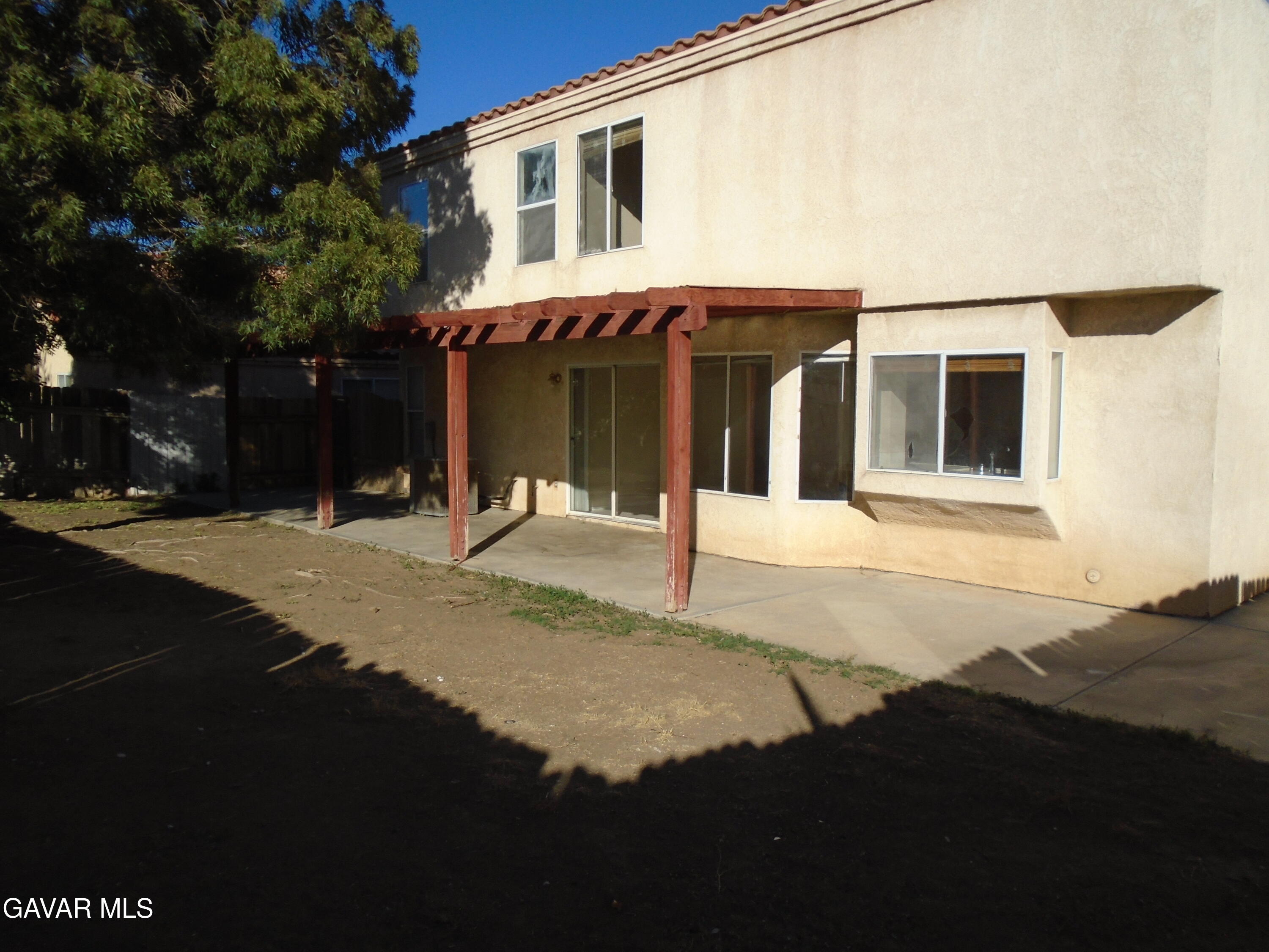 37739 Cardiff Street Palmdale, CA 93550 - Photo 31 of 32 a front view of a house with a yard