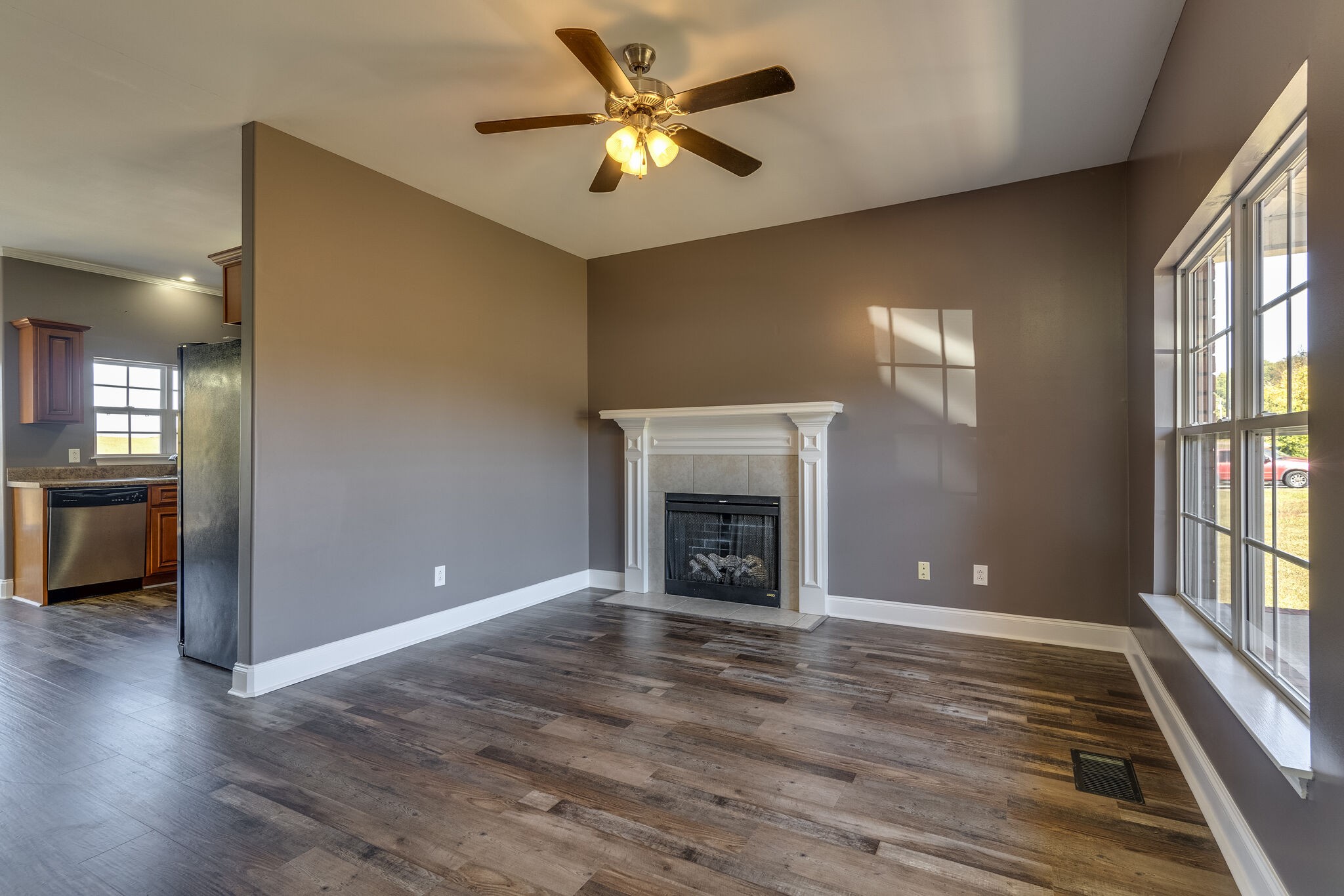 389 Coker Ford Road Portland, TN 37148 - Photo 3 of 15 a view of an empty room with window and wooden floor
