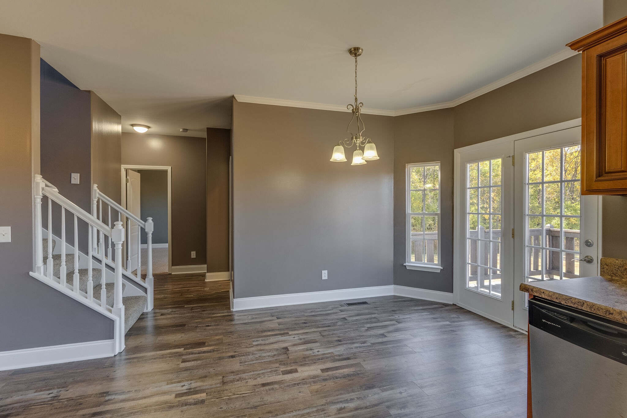 389 Coker Ford Road Portland, TN 37148 - Photo 7 of 15 a view of an empty room with wooden floor and a window