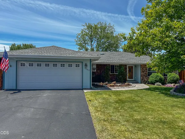 a view of a house with swimming pool and a yard