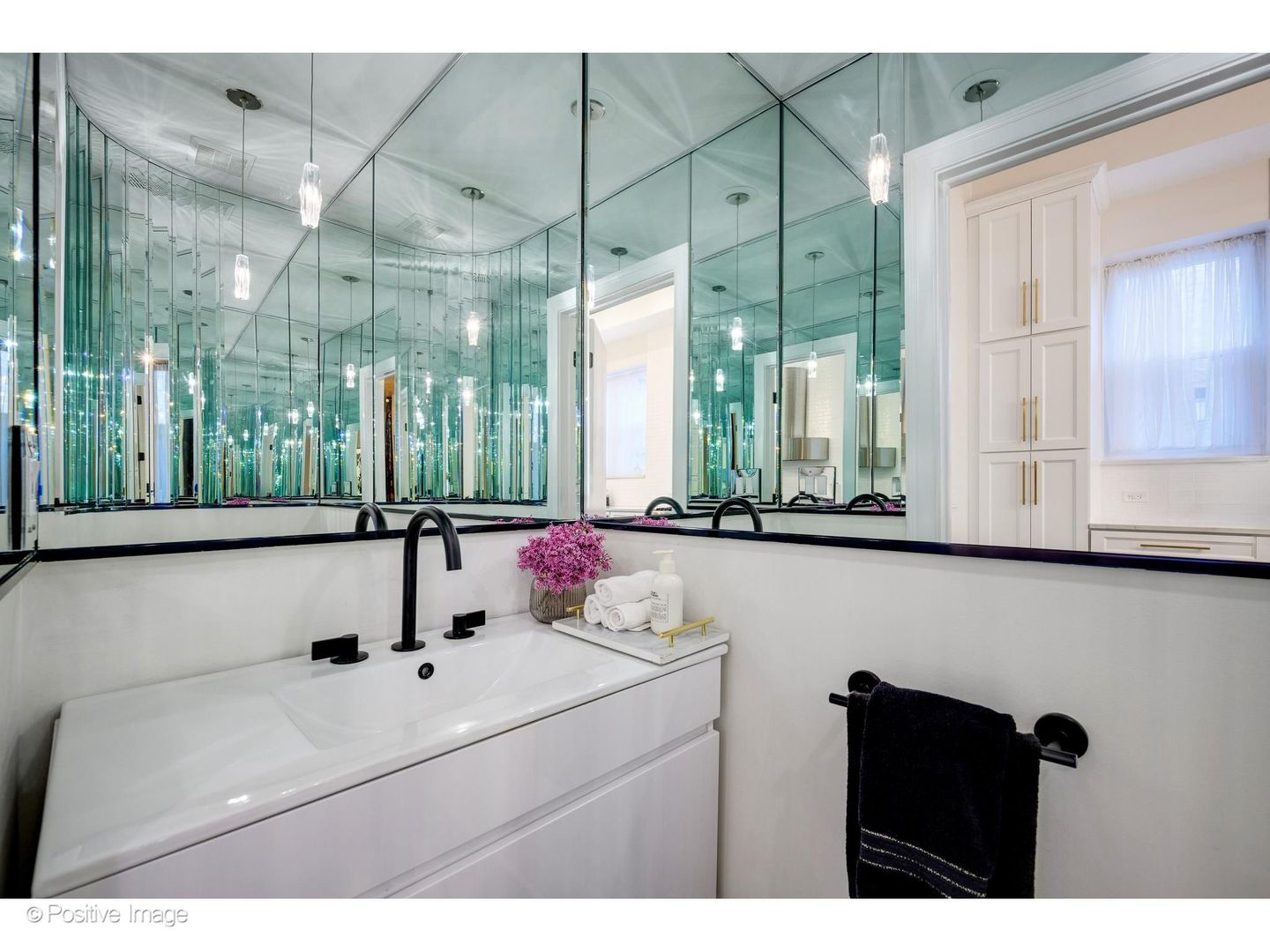 32 East Bellevue Place Chicago, IL 60611 - Photo 20 of 52 a bathroom with a sink and a mirror