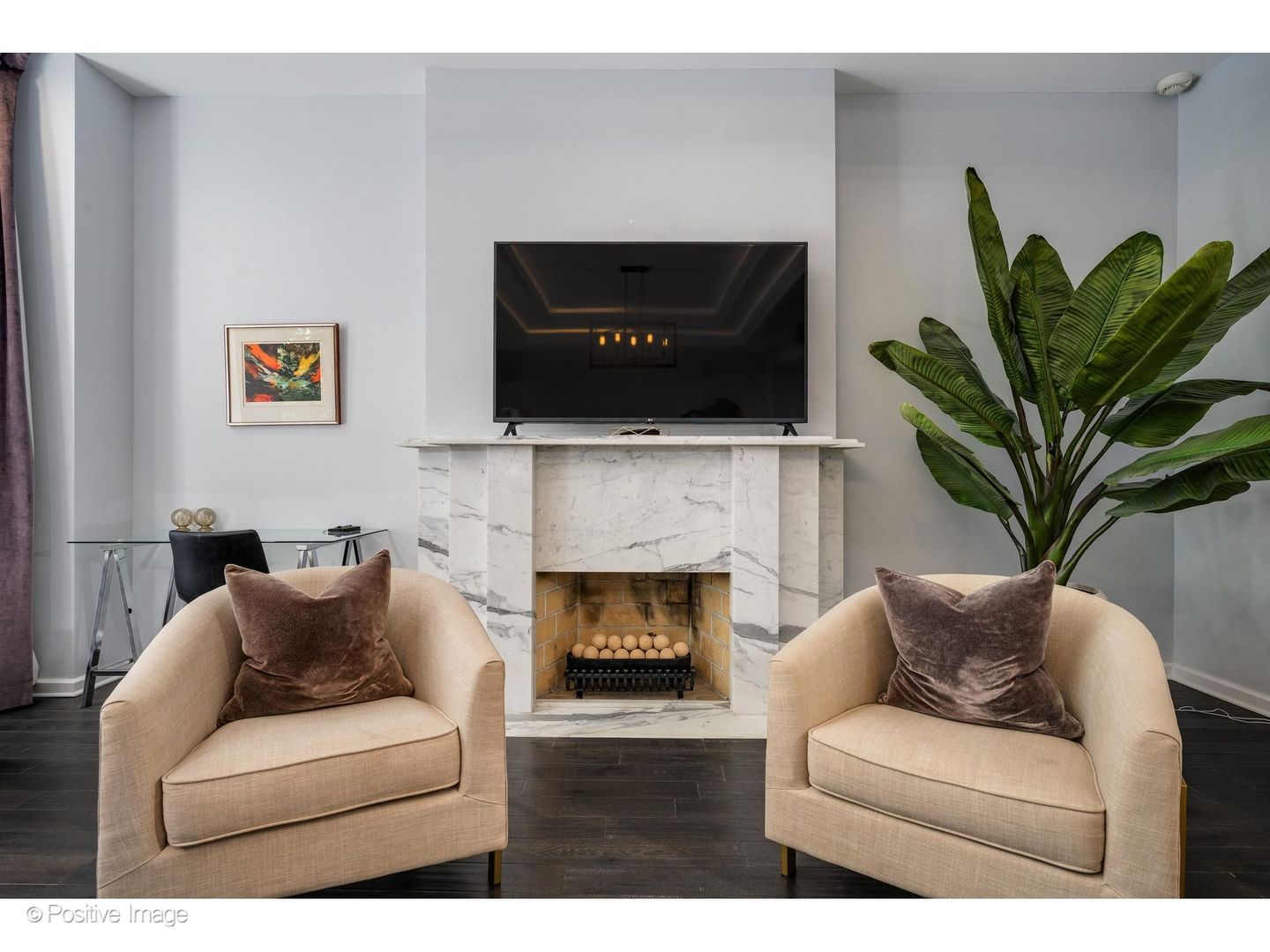 32 East Bellevue Place Chicago, IL 60611 - Photo 23 of 52 a living room with furniture a fireplace and a potted plant