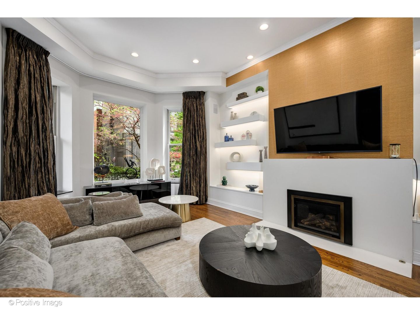 32 East Bellevue Place Chicago, IL 60611 - Photo 6 of 52 a living room with furniture a fireplace and a flat screen tv