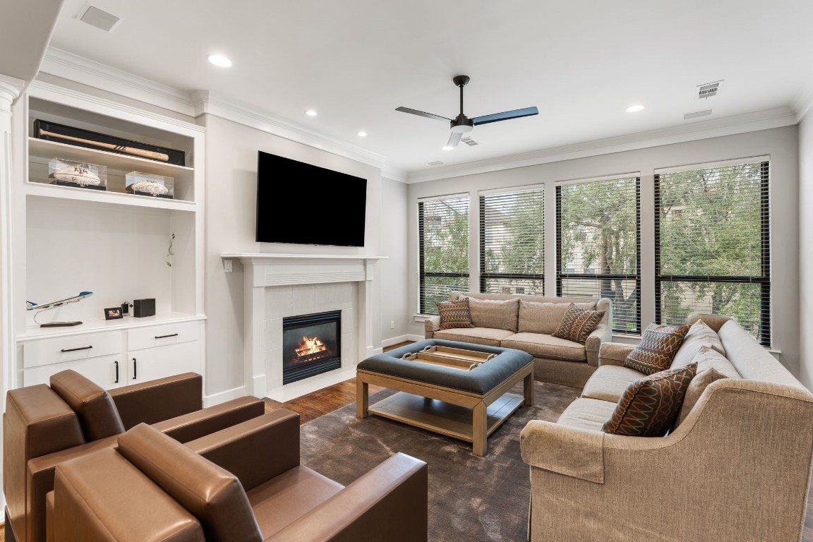 6501 Rodrigo Street Houston, TX 77007 - Photo 15 of 38 Open living room with large windows that flood the space with natural light (2nd floor). *Fireplace is digitally rendered.