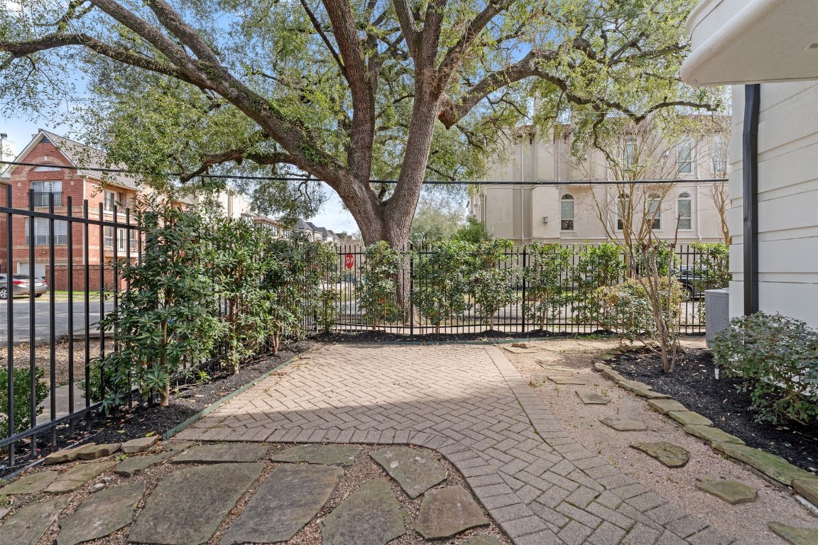 6501 Rodrigo Street Houston, TX 77007 - Photo 33 of 38 Features a charming gated front yard with fresh landscaping and an updated sprinkler system.