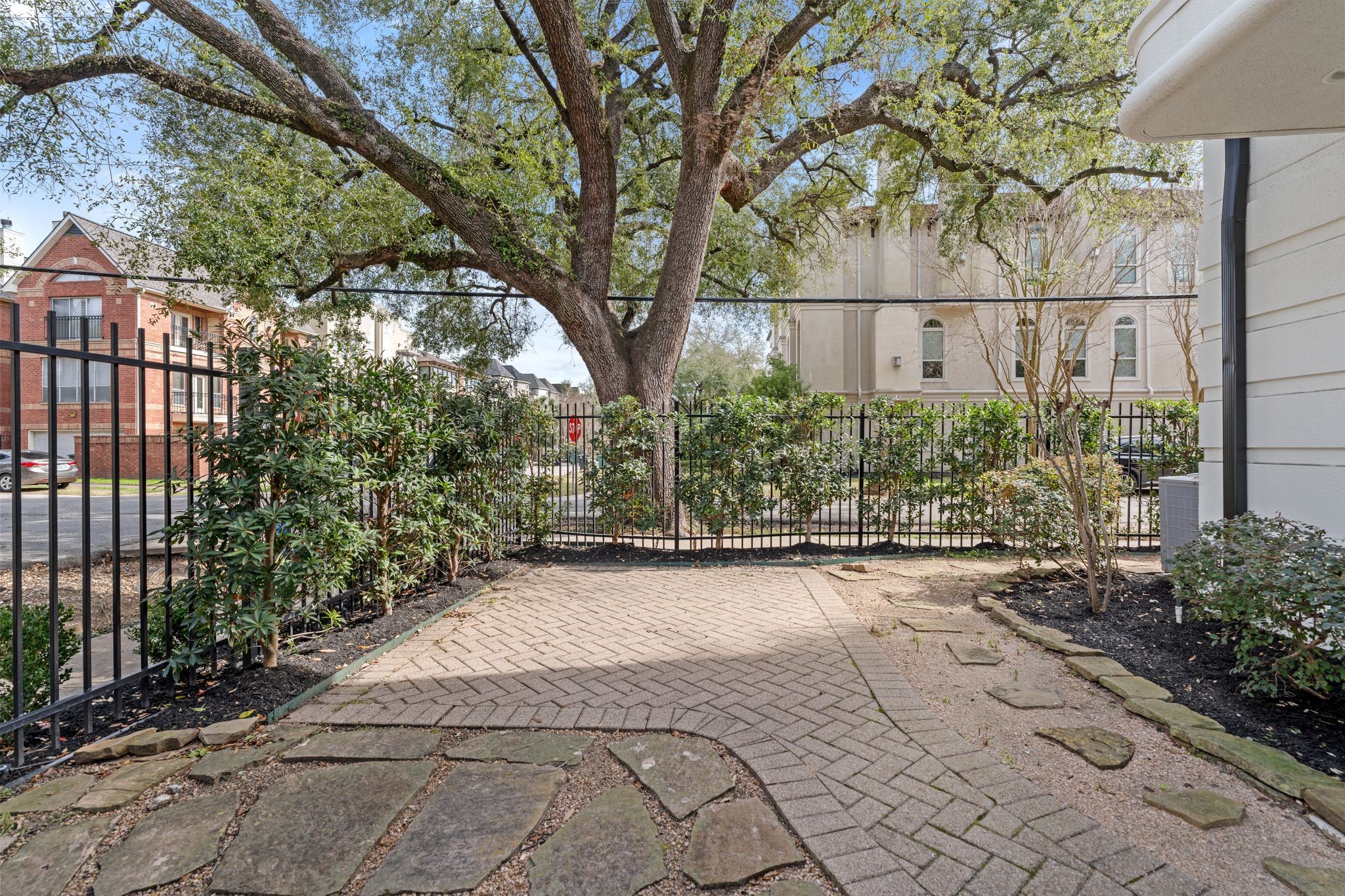 6501 Rodrigo Street Houston, TX 77007 - Photo 33 of 38 Features a charming gated front yard with fresh landscaping and an updated sprinkler system.