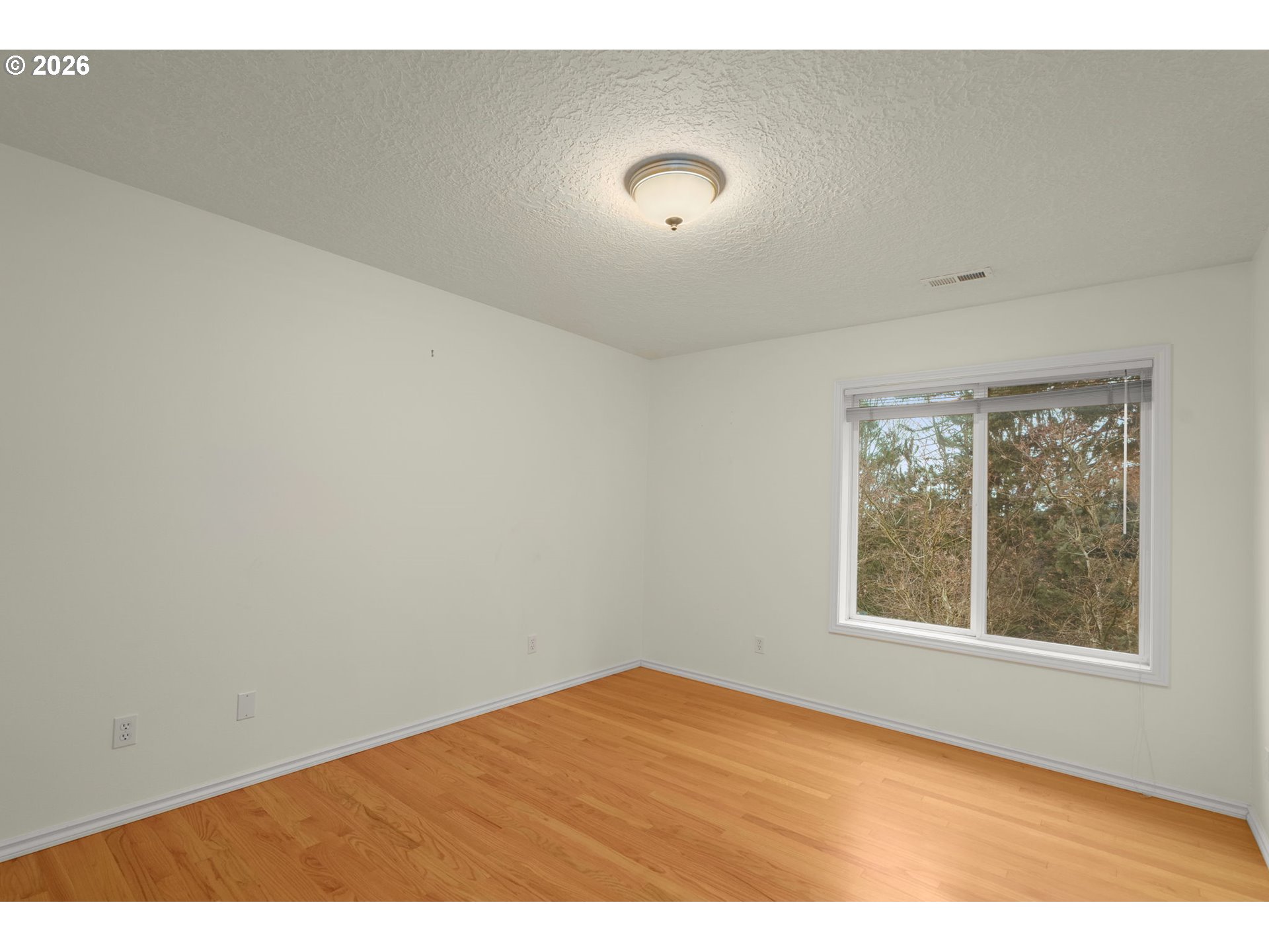 1323 Northwest Mayfield Road Portland, OR 97229 - Photo 24 of 32 a view of an empty room with a window