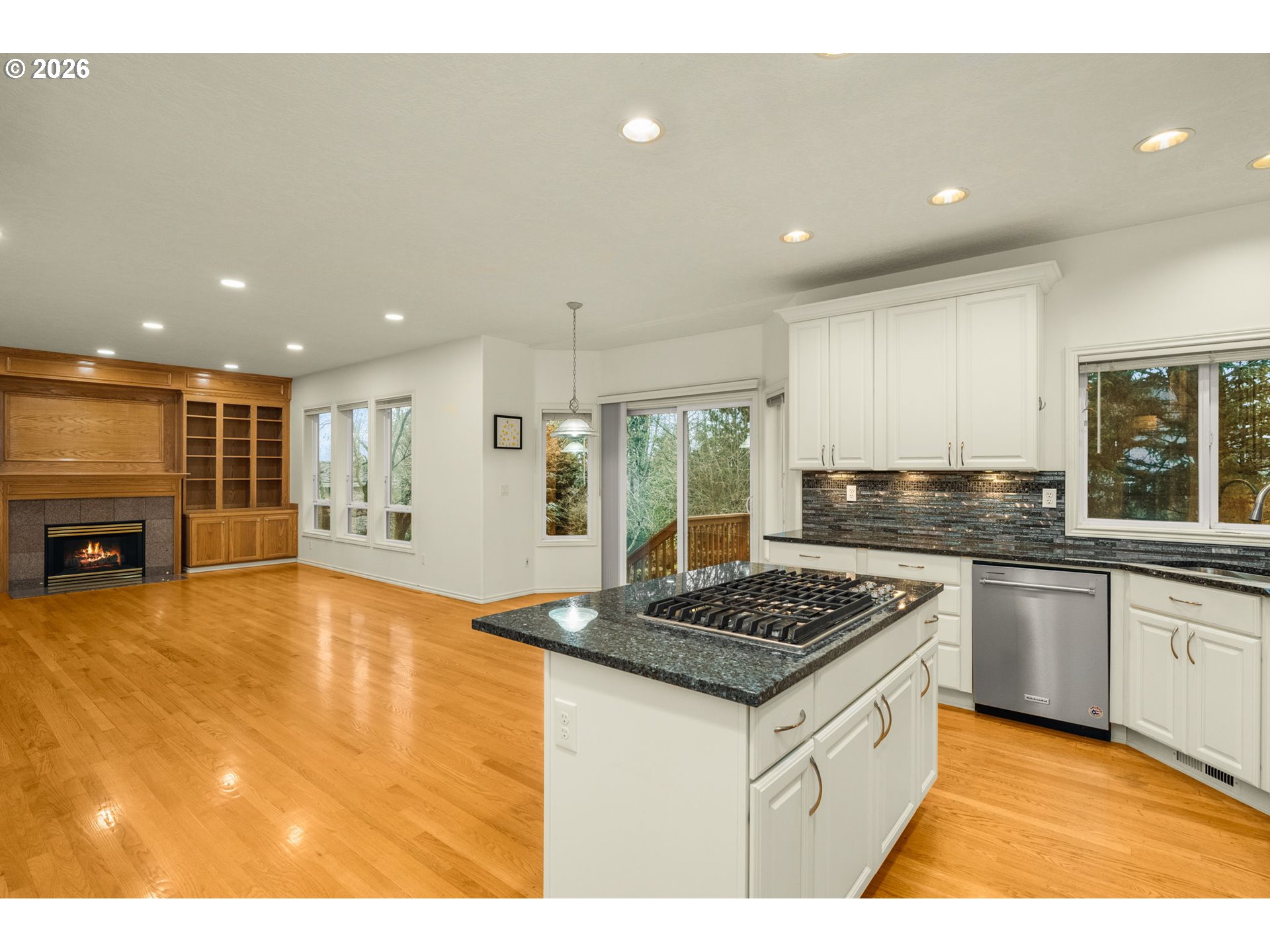 1323 Northwest Mayfield Road Portland, OR 97229 - Photo 6 of 32 a kitchen with stainless steel appliances granite countertop a stove a sink a refrigerator and a microwave