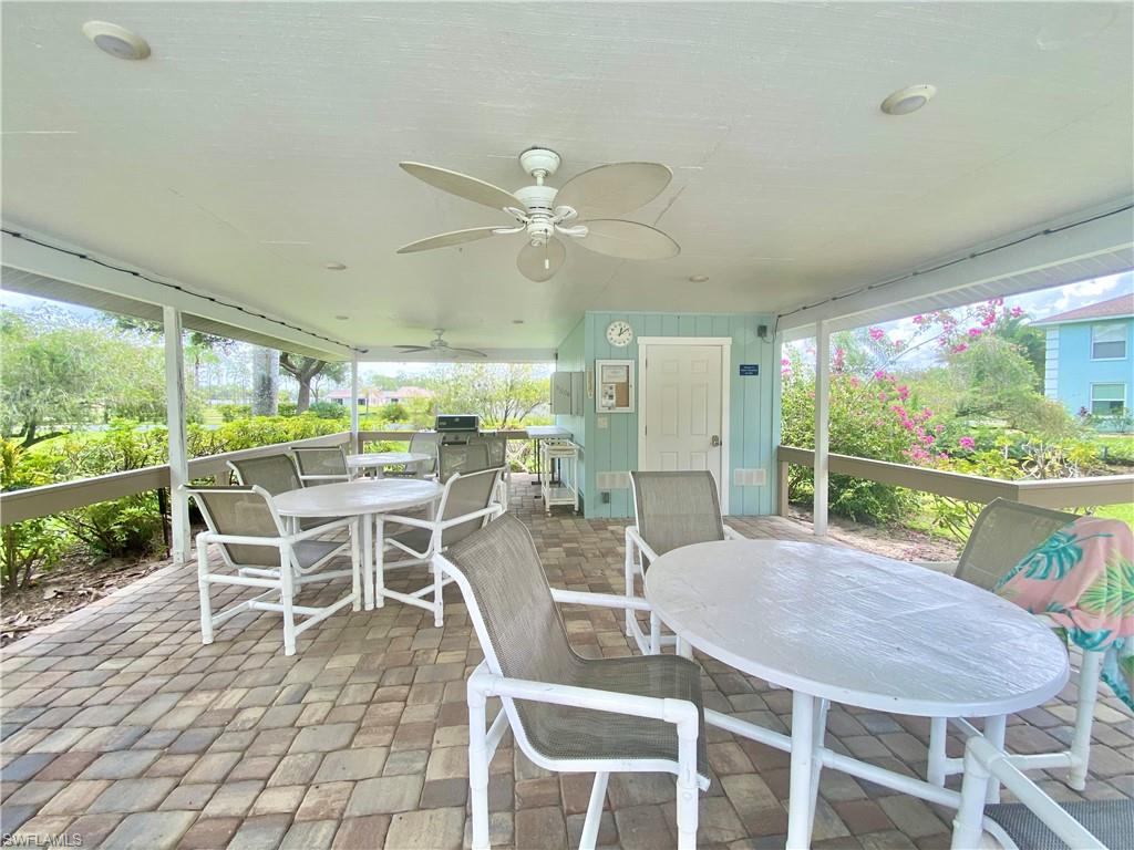 5735 Whitaker Road, Unit B201 Naples, FL 34112 - Photo 19 of 26 a view of a dining room with furniture window and outside view