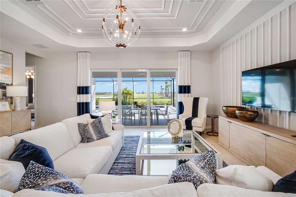 7165 Inlet Isles Lakewood Ranch, FL 34202 - Photo 3 of 26 a living room with furniture or outdoor view and a large window