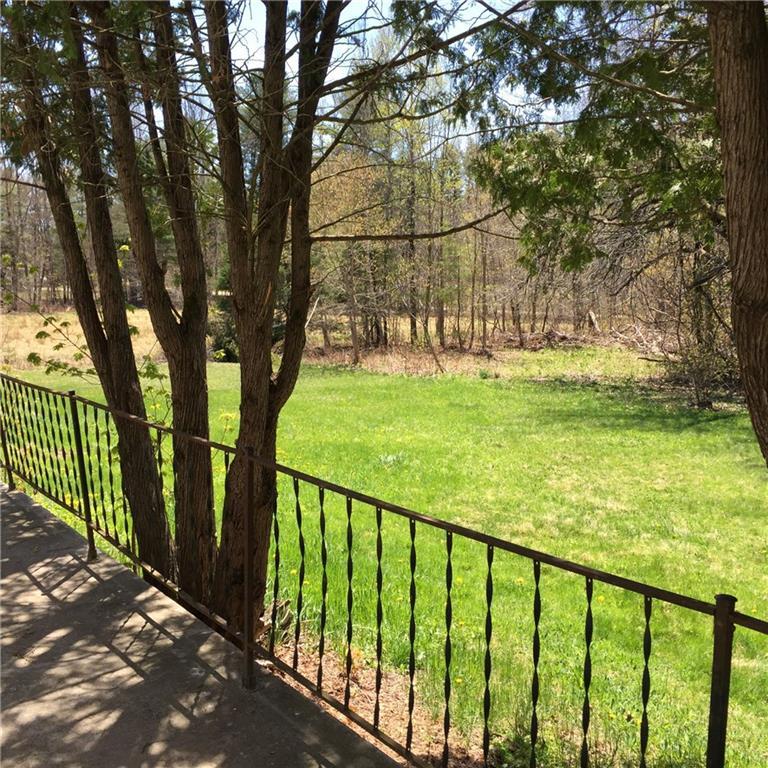 24 Wilton Road Farmington, ME 04938 - Photo 4 of 33 View off patio, sun and shady area's
