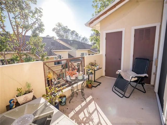 a view of a patio with furniture and backyard