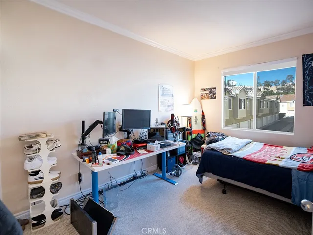 a bedroom with furniture a bed and a window