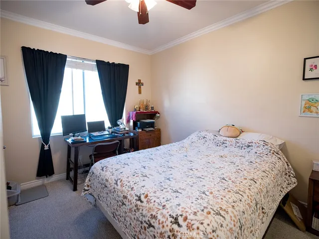 a bedroom with a bed and window