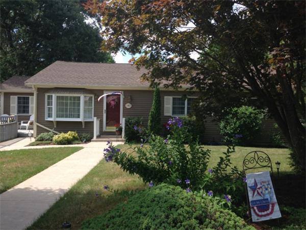 145 Star Avenue Woonsocket, RI 02895 - Photo 1 of 20 a front view of a house with garden