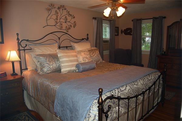 145 Star Avenue Woonsocket, RI 02895 - Photo 11 of 20 a bedroom with a bed and a chandelier